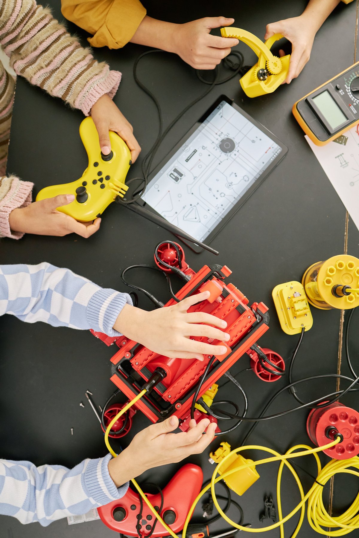 Children collaborating on robot building project